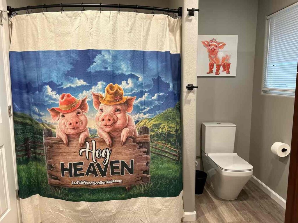 bathroom with pig themed decor