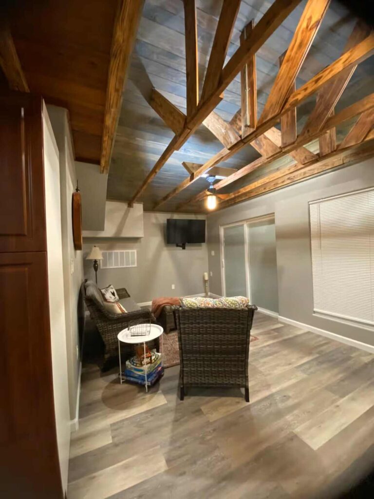 cabin living area showing beams and seating