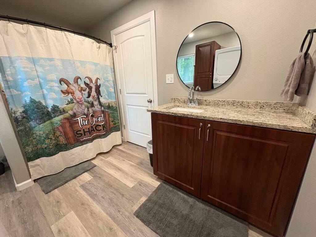 view of the bathroom and shower at the goat shack cabin