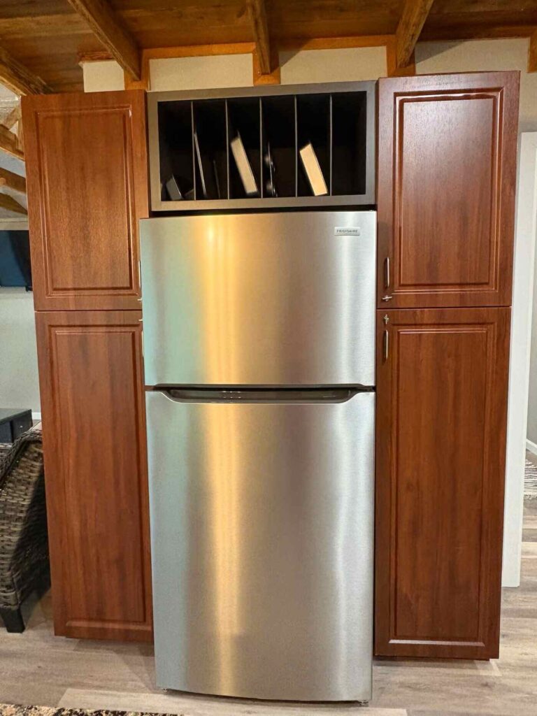 fridge in the kitchen of the goat shack cabin